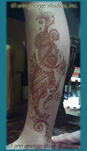 red henna tattoo on leg